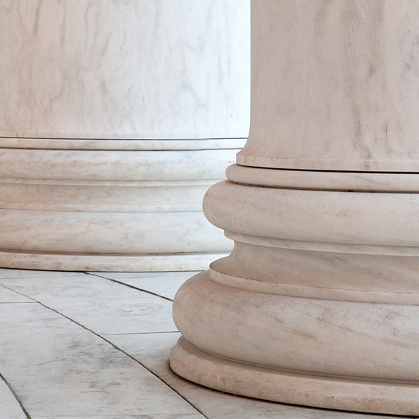 Photograph of two white columns.